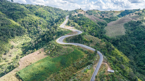 High angle view of road amidst mountains