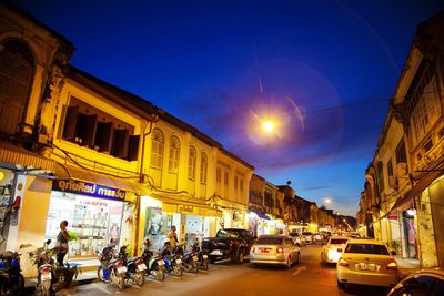 Cars on road in city at night