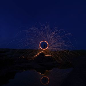 Light painting against sky at night