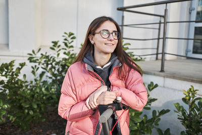 Portrait of woman standing outdoors