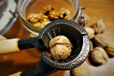 Cracking walnuts with nutcracker.