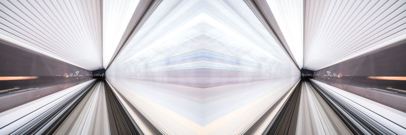 Digital composite image of illuminated ceiling in city