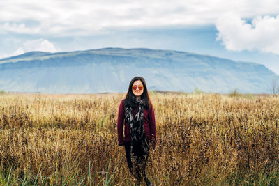 Portrait of woman on snow covered mountain