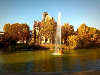 View of trees by lake during autumn