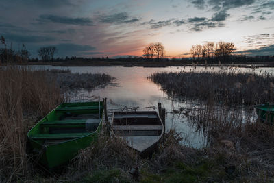 Fishing boats on the lake shore, the spring view after dusk