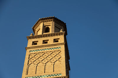 Low angle view of building against clear blue sky