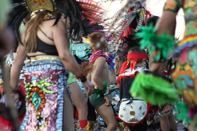 Group of people dancing in music concert