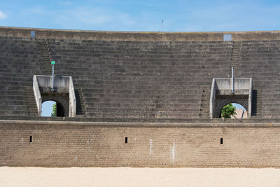 Bird on wall against building