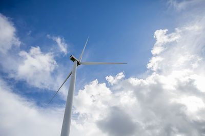 Low angle view of windmill against sky