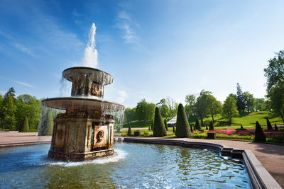 View of fountain in park against sky