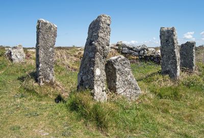 Old ruins on field against sky