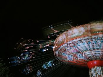 Low angle view of illuminated ferris wheel