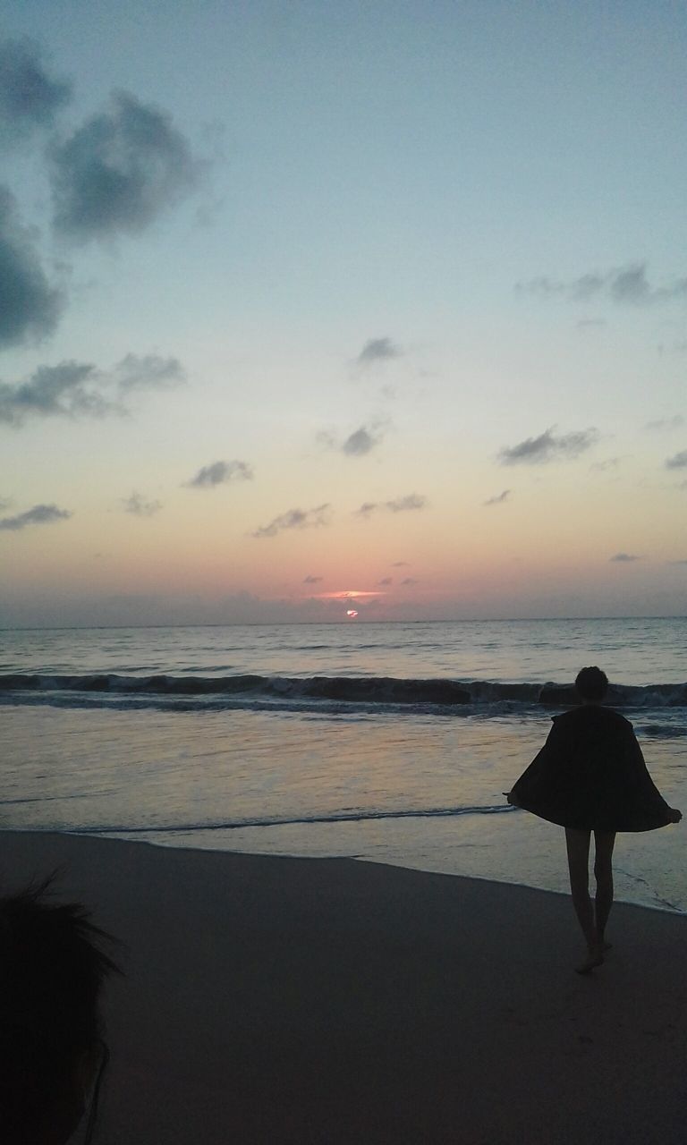 sea, beach, horizon over water, sunset, sky, water, beauty in nature, sand, nature, scenics, cloud - sky, one person, leisure activity, real people, outdoors, people, adult, adults only, day