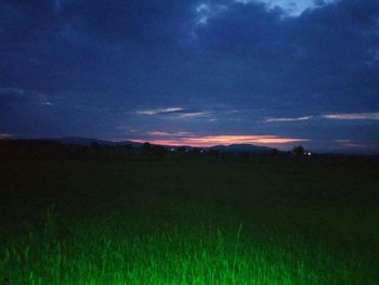 Scenic view of landscape against cloudy sky