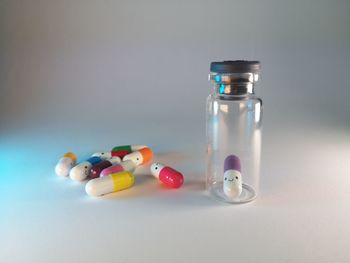 Close-up of multi colored candies in glass on table