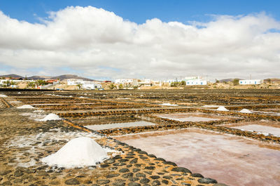 Residential district against cloudy sky