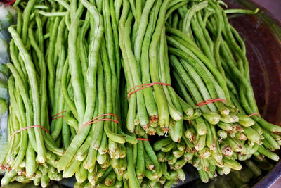 Chinese long beans for sale at market stall