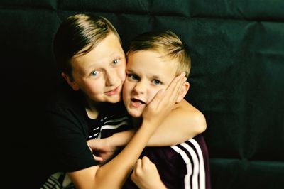 Portrait of two boys hugging