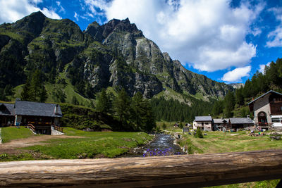 Scenic view of mountains against cloudy sky