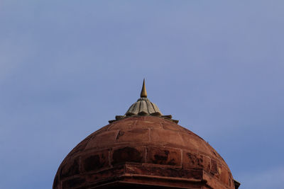 Low angle view of a building against blue sky