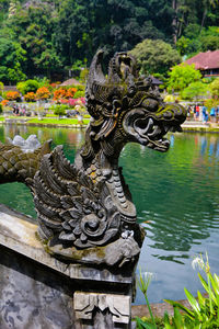 Close-up of statue against trees