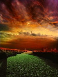 Scenic view of landscape against cloudy sky