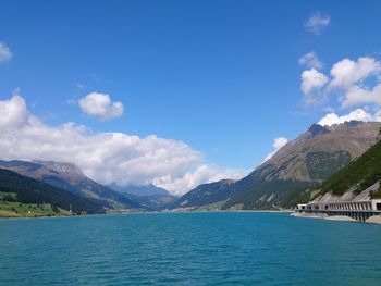 Scenic view of mountains against cloudy sky