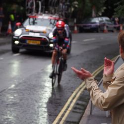 Rear view of woman on bicycle on city street