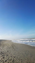 Scenic view of beach against clear sky