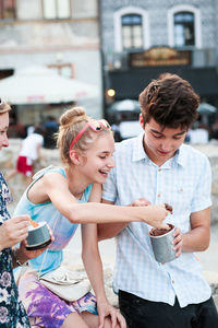 Family having ice cream at market