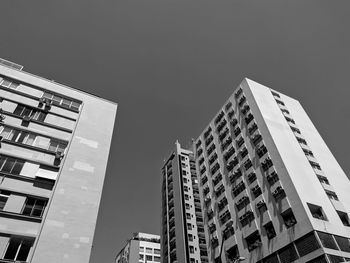 Low angle view of modern buildings against clear sky