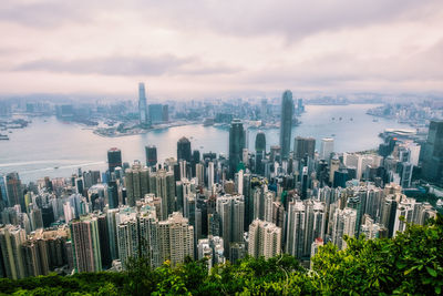 High angle view of modern buildings in city against sky