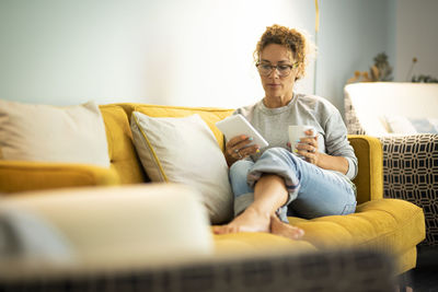 Portrait of senior man using digital tablet at home