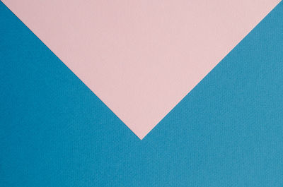 Close-up of blue and pink paper