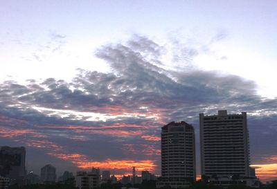 High angle view of city against cloudy sky