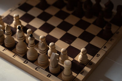 High angle view of chess pieces on floor