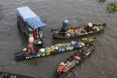 High angle view of people selling food in boat