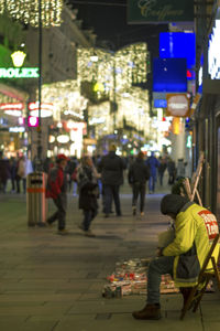 Crowd on city street at night