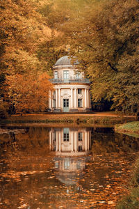 Reflection of building on lake during autumn