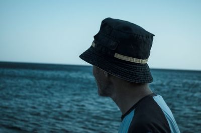 Man looking at sea against sky 