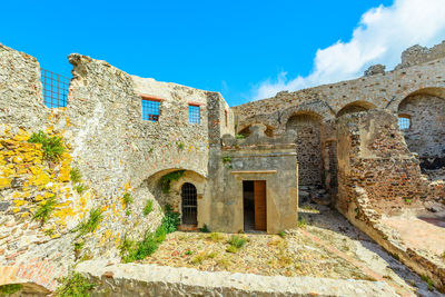 Low angle view of old building against sky