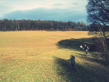 People walking on grass