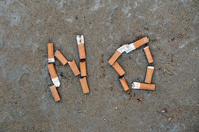 High angle view of cigarette on road