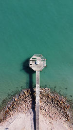 High angle view of coin-operated binoculars by sea