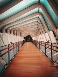 Empty walkway in illuminated building