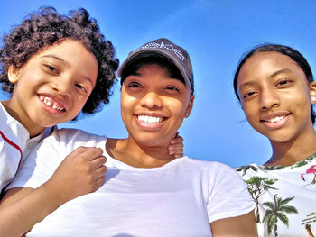 Portrait of happy boy smiling friends