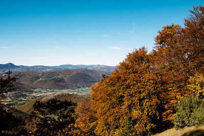 Scenic view of tree mountains against sky during autumn