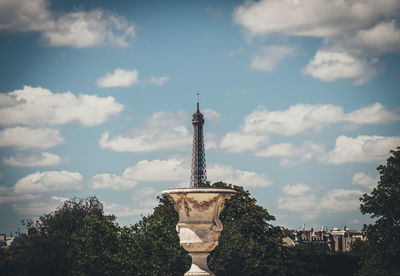 Low angle view of building against cloudy sky