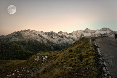 Scenic view of snowcapped mountains against sky during sunset