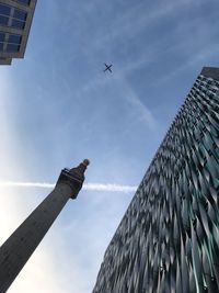 Low angle view of airplane flying in sky